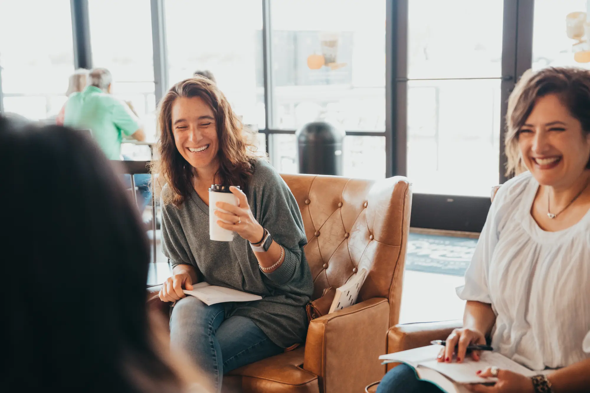 A small group meeting around a living room