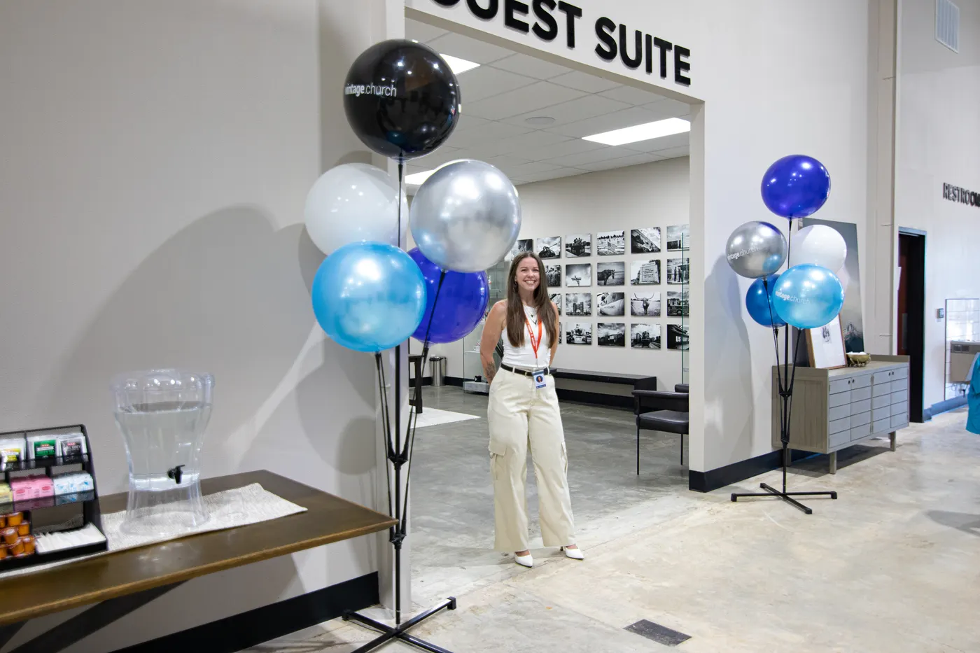 A guest experience team member greeting people