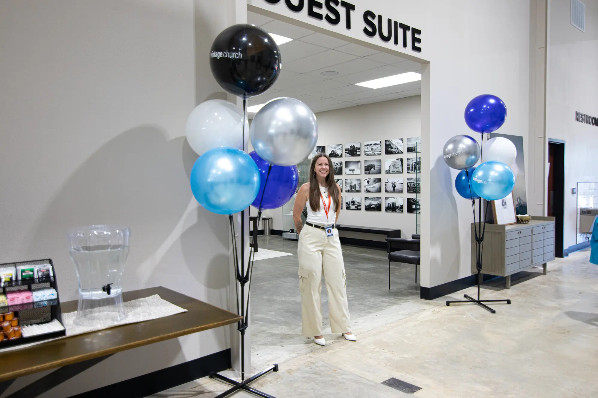 A guest experience team member greeting people
