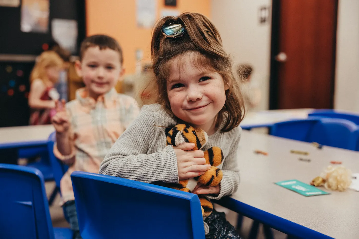 Kids learning and laughing in a Vintage Kids room