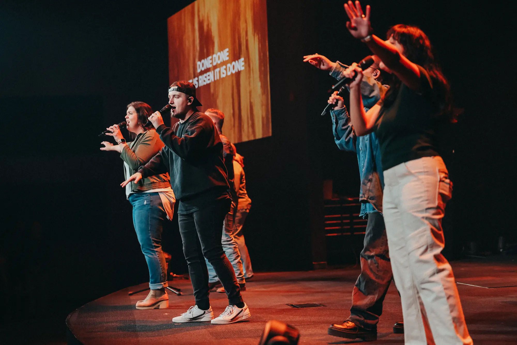 The room responding together in worship