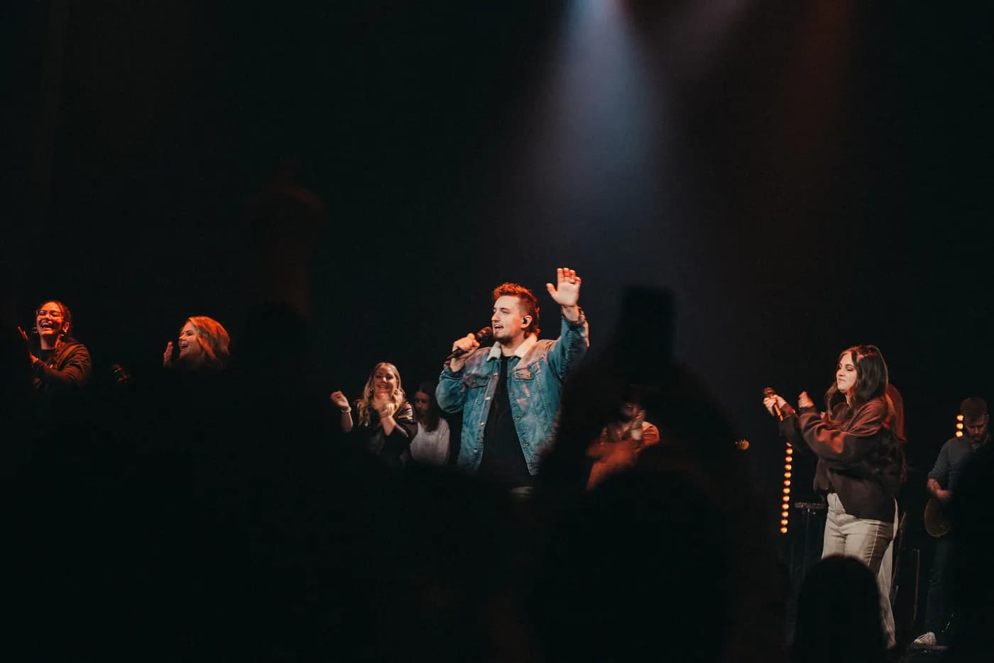 Worship under the lights at a Sunday gathering