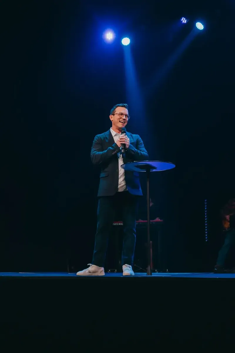 Pastor Stephen Martin preaching on stage